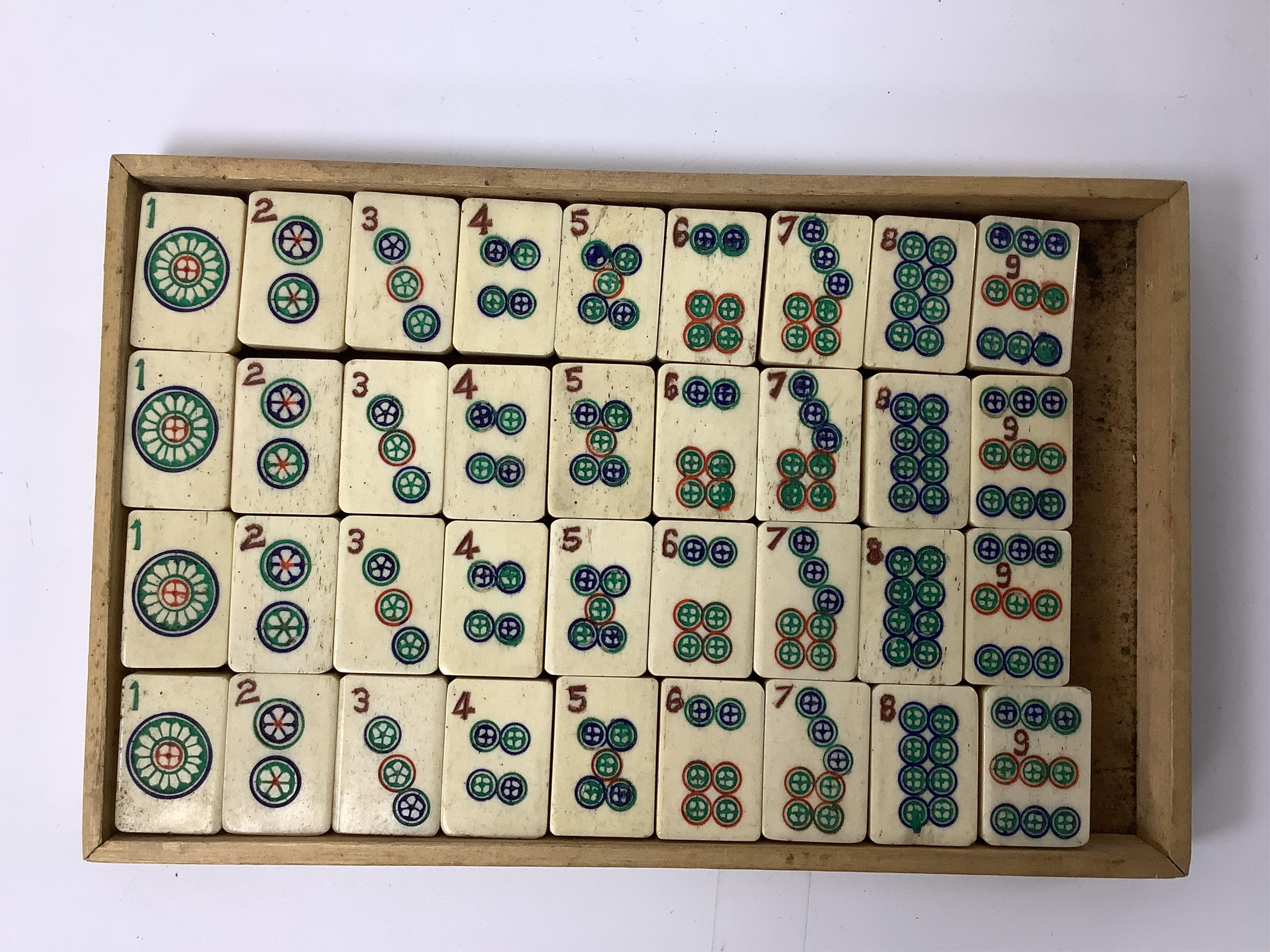 A Chinese bone mahjong set, cased, 23cm wide. Condition - fair
